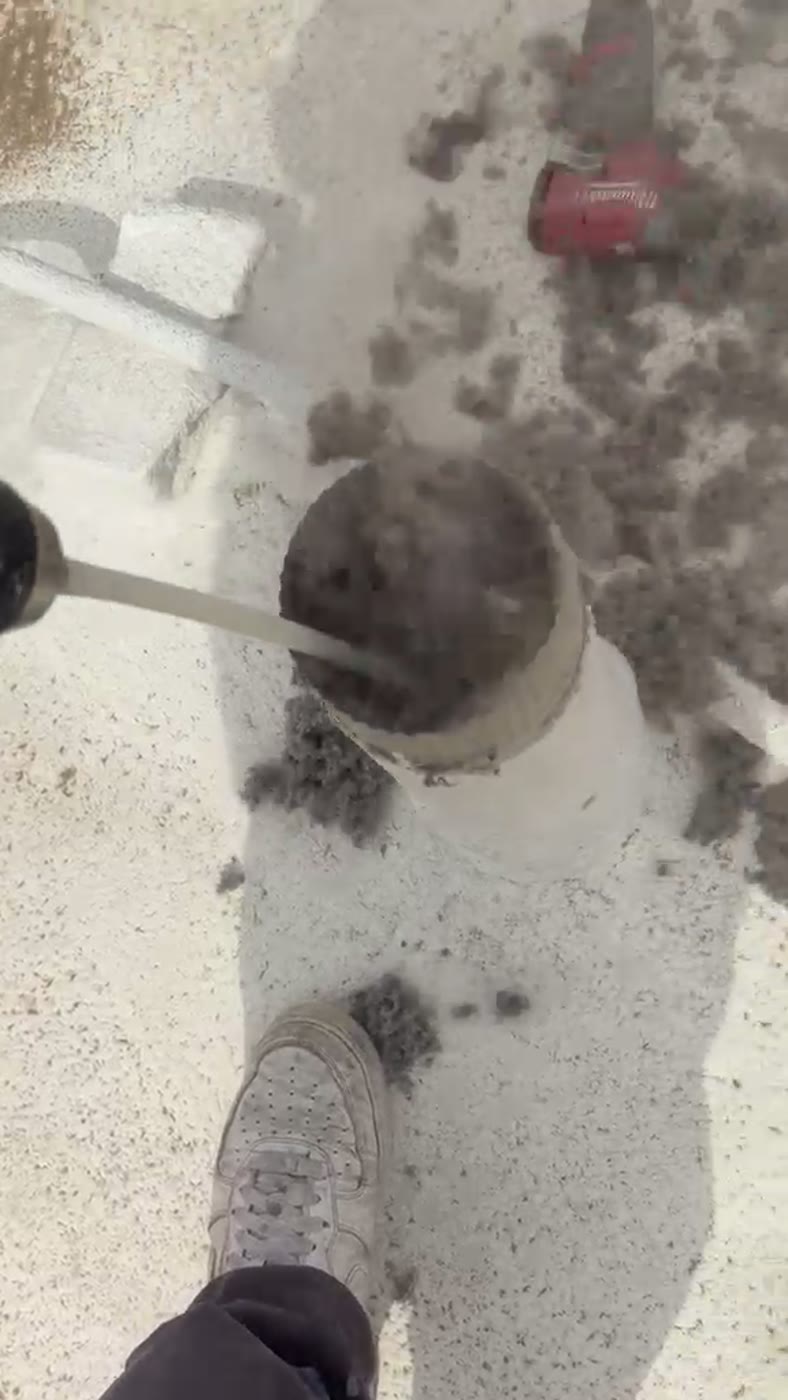 Green World Air Care technician on a real Connecticut job, cleaning a clogged dryer vent