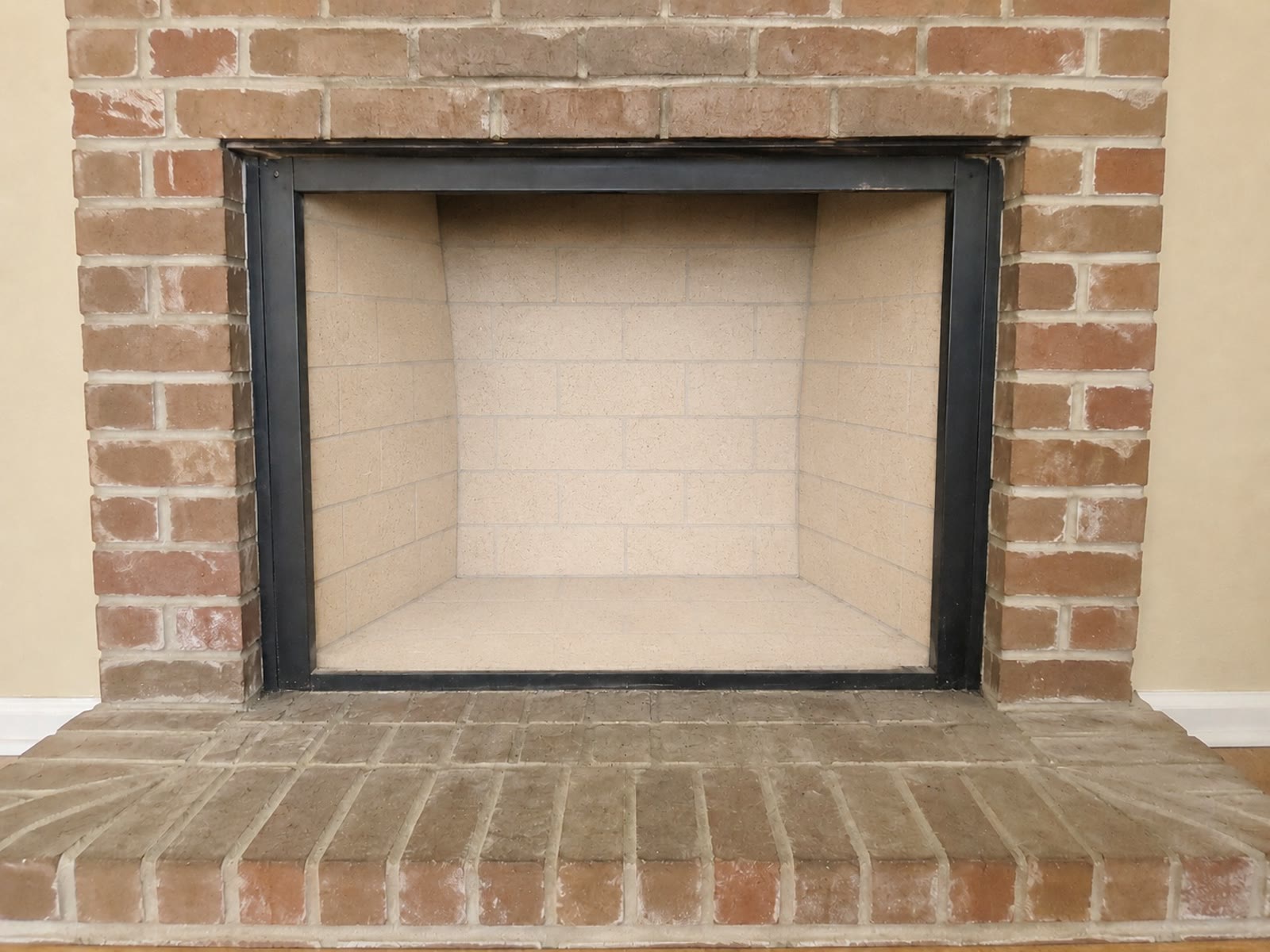 Professional chimney sweep performing creosote removal service